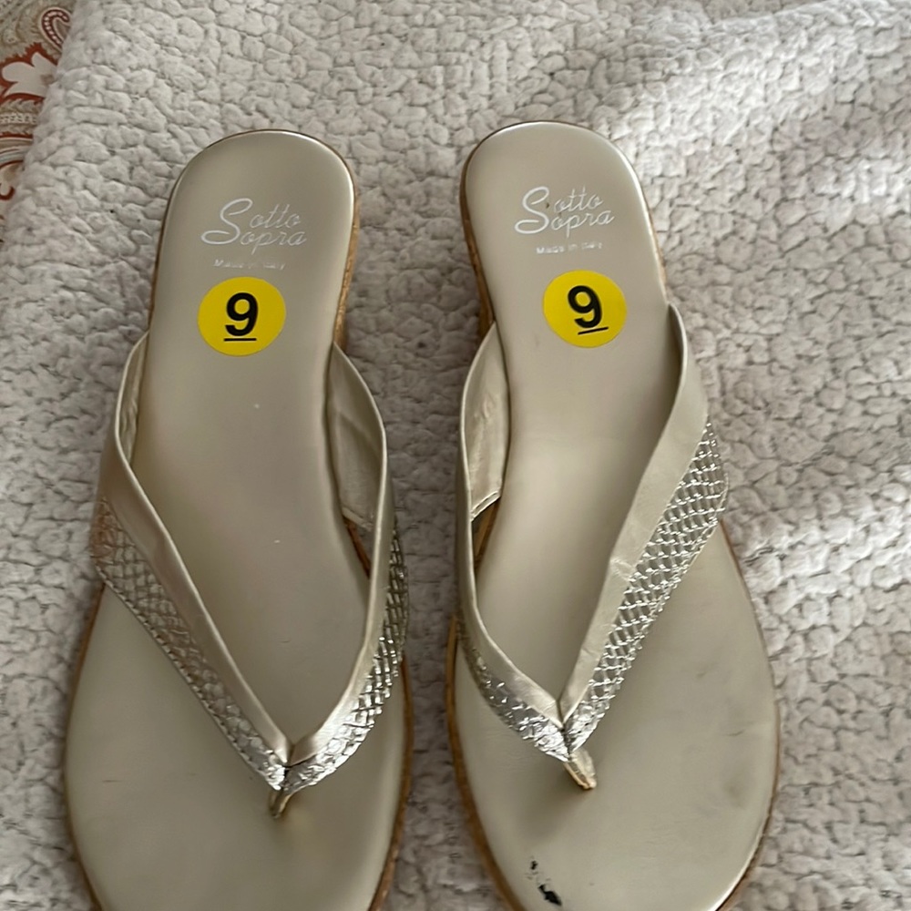 Gold sandals.  Like new   Tiny scratch on left toe - not visible when wearing